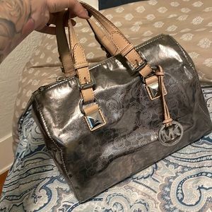 Real genuine MK . Pretty old looking for quick sale.